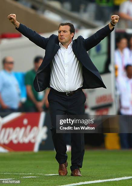 Head coach Marc Wilmots of Belgium celebrates his team's 2-1 victory over Algeria during the 2014 FIFA World Cup Brazil Group H match between Belgium...