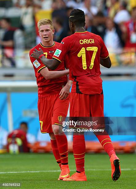 Kevin De Bruyne of Belgium celebrates with teammate Divock Origi after defeating Algeria 2-1 during the 2014 FIFA World Cup Brazil Group H match...