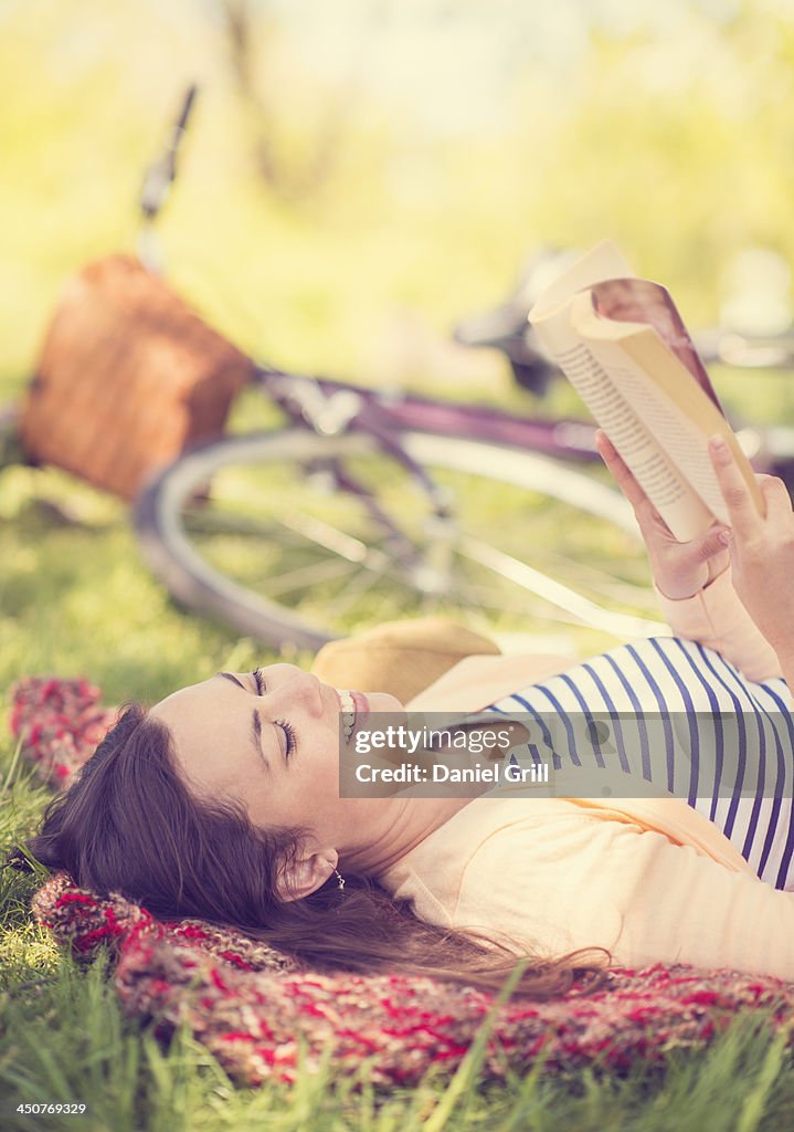 Mid adult woman reading book