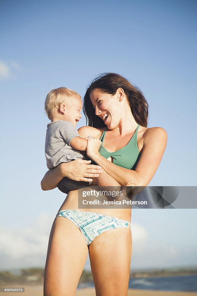 Mother with baby boy (6-11) in arms
