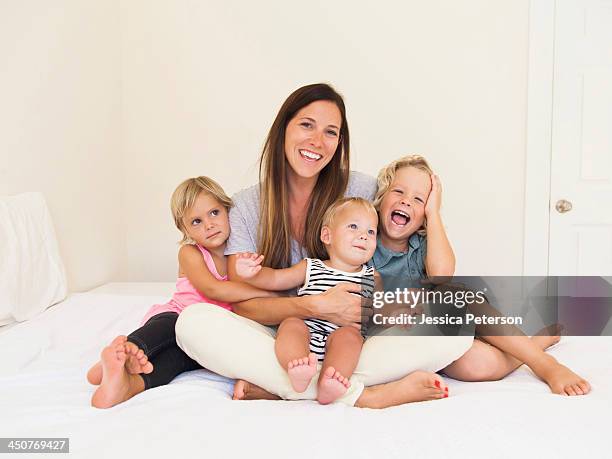 mother with three kids (6-7, 2-3, 6-11 months) - family with three children stock pictures, royalty-free photos & images