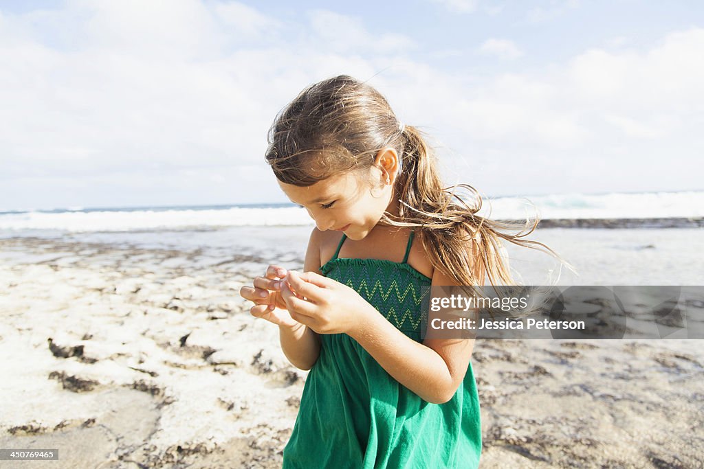 Girl (6-7) playing on beach