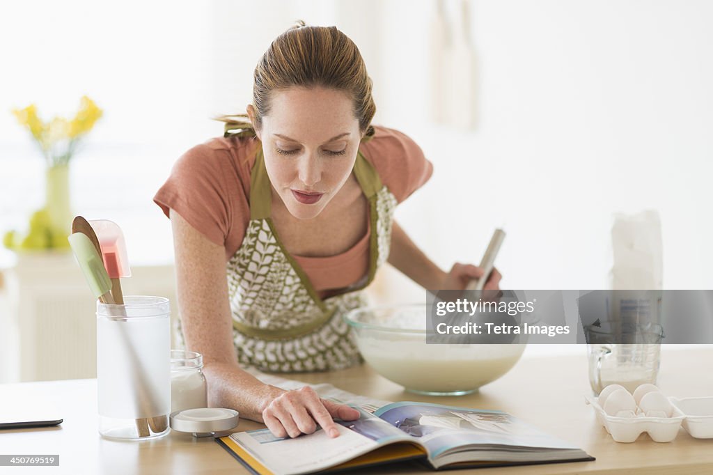 Woman cooking in kitchen