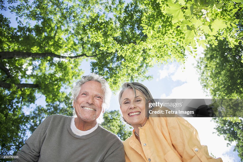 Senior couple under trees