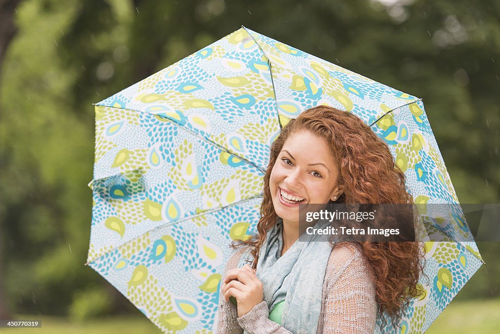 Portrait of young woman in park