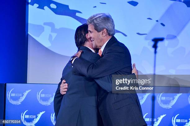 Secretary of State John Kerry greets actor Leonardo DiCaprio during the second and the final day of the 'Our Ocean' conference June 17, 2014 at the...