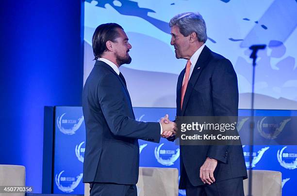 Secretary of State John Kerry greets actor Leonardo DiCaprio during the second and the final day of the 'Our Ocean' conference June 17, 2014 at the...