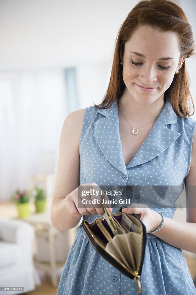 Teenage girl (14-15) with wallet