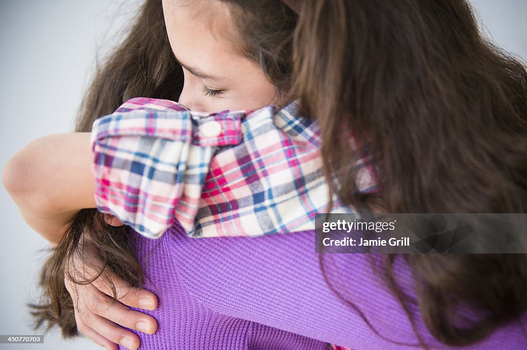 Friends in close embrace