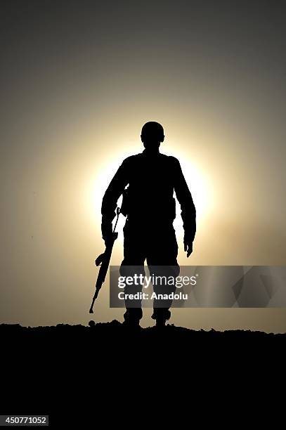 Kurdish Peshmerga forces stand guard in the oil-rich city of Kirkuk against Islamic State of Iraq and the Levant on June 17, 2014. Kurdish Peshmerga...