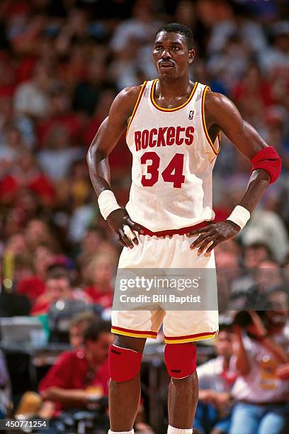 Hakeem Olajuwon of the Houston Rockets stands on the court during Game Two of the NBA Finals against the New York Knicks on June 10, 1994 at The...