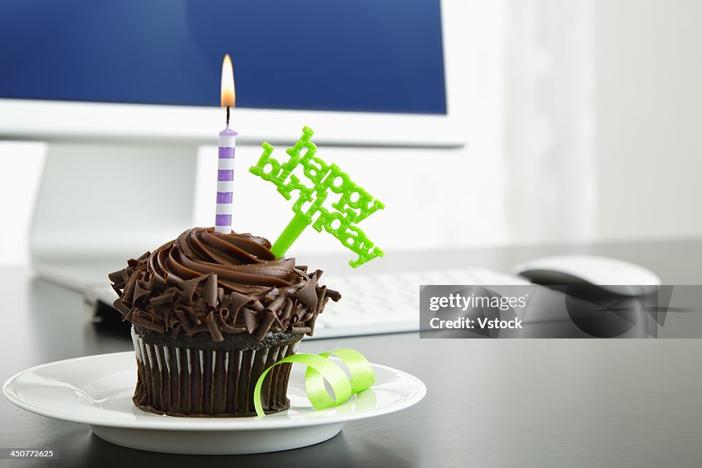 Birthday cupcake on desk