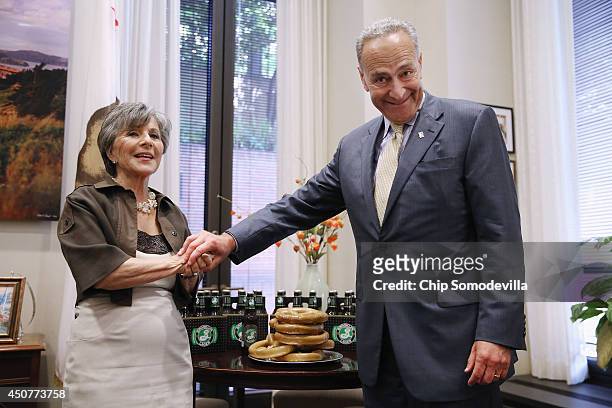 Sen. Charles Schumer presents U.S. Sen. Barbara Boxer with pretzels and beer from New York to settle a wager the two had over the National Hockey...