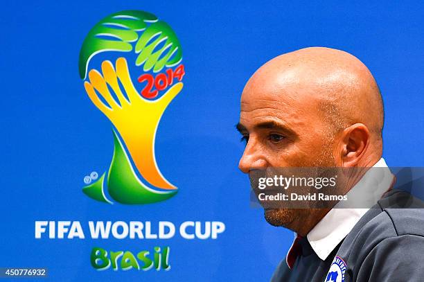 Head coach Jorge Sampaoli of Chile leaves the Chile press conference ahead of their 2014 FIFA World Cup Group B match against Chile at Maracana on...