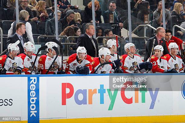 Interim Head Coach Peter Horachek and Assistant Coach John Madden of the Florida Panthers follow the action from the bench during a game against the...