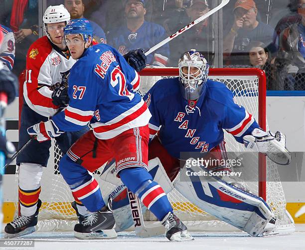 Henrik Lundqvist of the New York Rangers keeps an eye on the puck against the Florida Panthers at Madison Square Garden on November 10, 2013 in New...