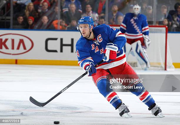 Ryan Callahan of the New York Rangers passes the puck against the Florida Panthers at Madison Square Garden on November 10, 2013 in New York City....