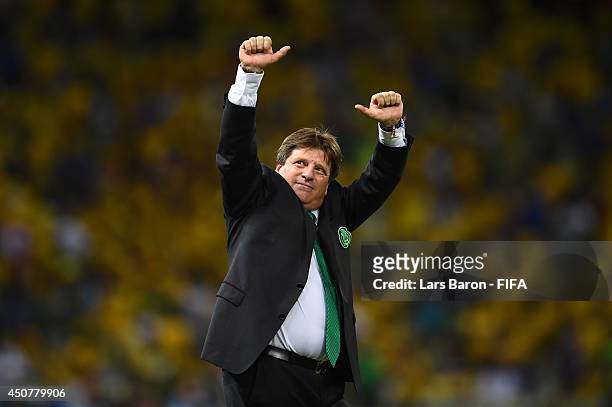 Coach Miguel Herrera of Mexico applauds the fans after the 2014 FIFA World Cup Brazil Group A match between Brazil and Mexico at Estadio Castelao on...