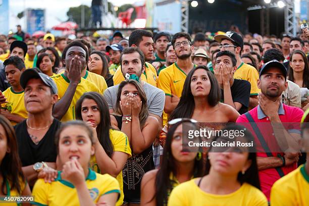 Brazilian fans watch the Group A Match between Brazil and Mexico at the FIFA Fan Fest at Taguatinga on June 17, 2014 in Brasilia, Brazil.