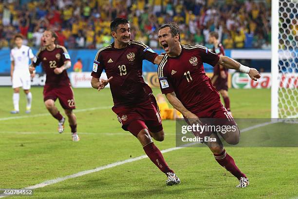 Aleksandr Kerzhakov of Russia celebrates scoring his team's first goal with Alexander Samedov during the 2014 FIFA World Cup Brazil Group H match...