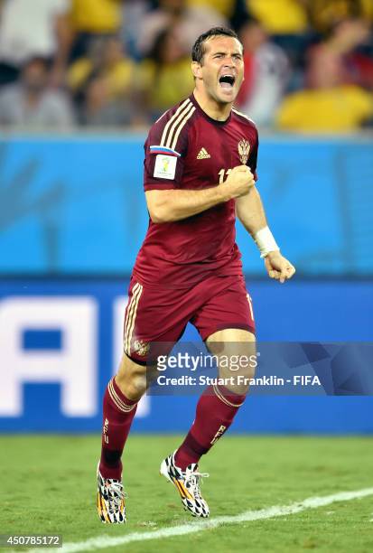 Aleksandr Kerzhakov of Russia celebrates after scoring the team's first goal during the 2014 FIFA World Cup Brazil Group H match between Russia and...