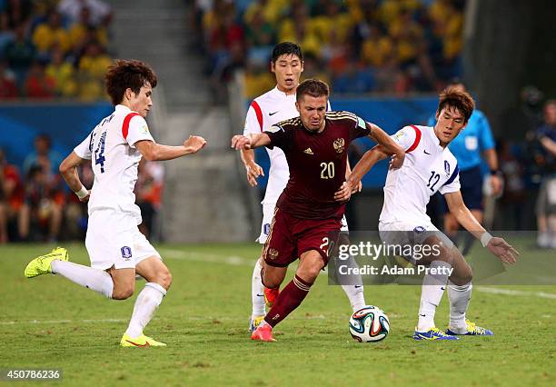Victor Fayzulin of Russia controls the ball against Han Kook-Young and Lee Yong of South Korea during the 2014 FIFA World Cup Brazil Group H match...