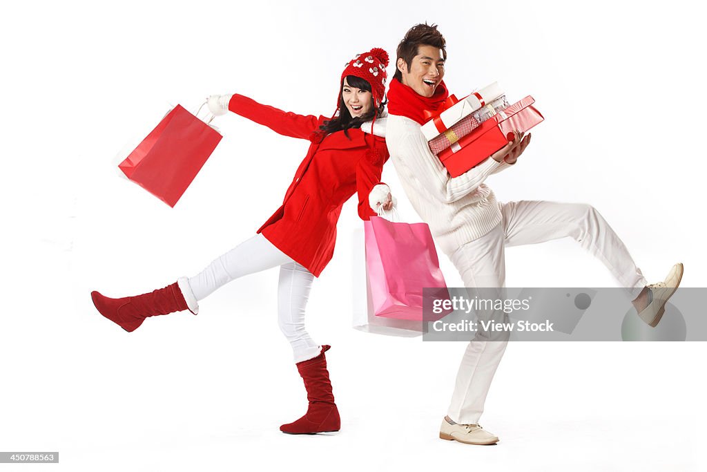 Young couple holding Christmas gift