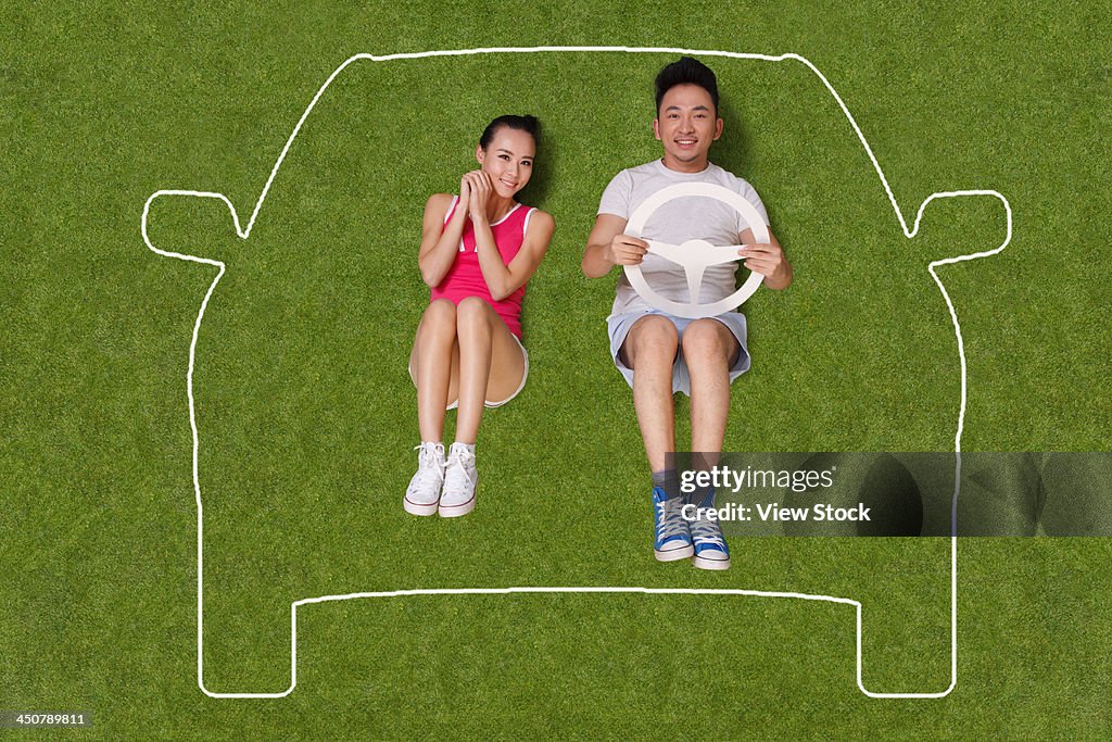 Young people lying on grass