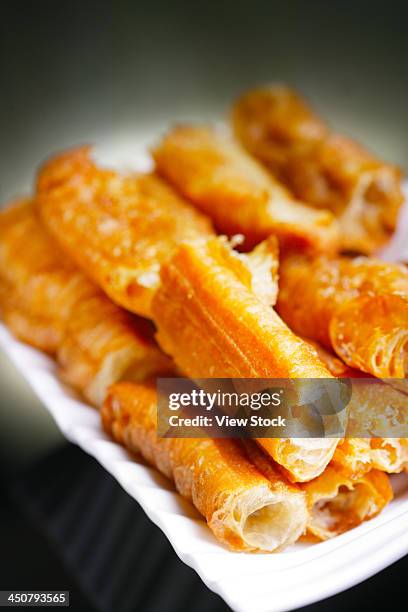 deep-fried dough sticks - youtiao stock pictures, royalty-free photos & images