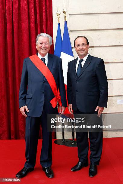 French Republic's President Francois Hollande presents the insignia of "Grand Croix de la Legion d'Honneur" to CEO and Chairman of Global Investment...
