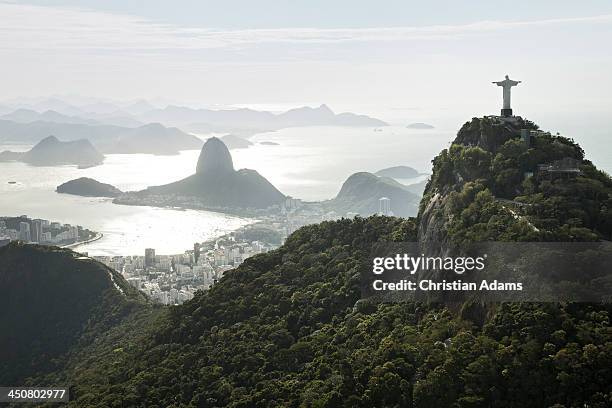 sunny view onto corcovado and sugarloaf - christusstatue stock-fotos und bilder