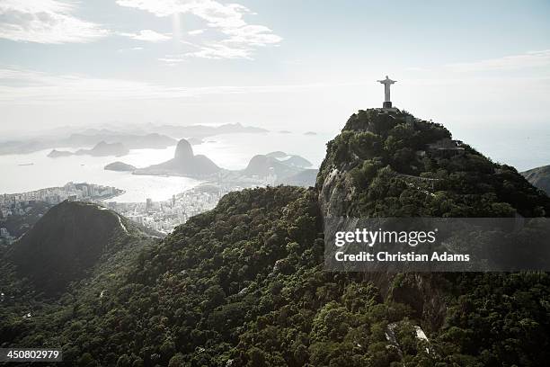 sunny view onto corcovado and sugarloaf - christ the redeemer rio stock-fotos und bilder