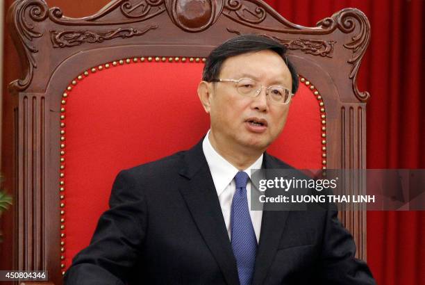 Chinese State Councillor Yang Jiechi speaks with Vietnamese Communist Party's General Secretary Nguyen Phu Trong during a meeting in Hanoi on June...