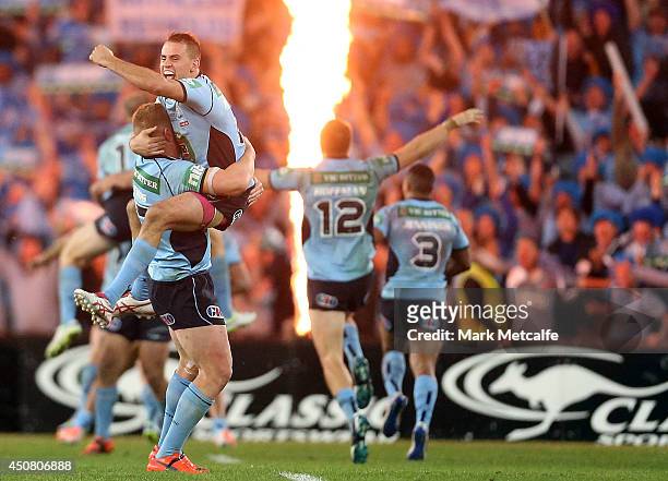 Josh Reynolds and Luke Lewis of the Blues celebrate victory in game two of the State of Origin series between the New South Wales Blues and the...