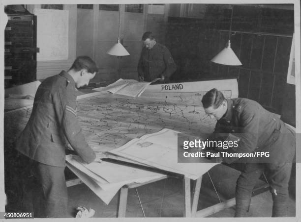 Officers assistants working on a map of Poland for the Peace Conference following World War One, Hotel Astoria, Paris, circa 1918-1920.