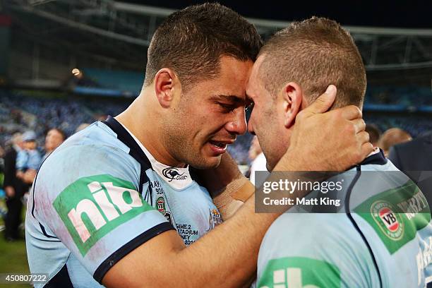 Jarryd Hayne of the Blues celebrates the series victory with Robbie Farah during game two of the State of Origin series between the New South Wales...