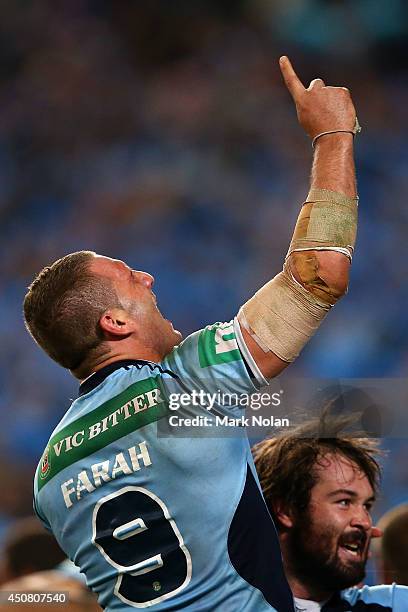 Robbie Farah of the Blues and Aaron Woods of the Blues celebrate winning the series after game two of the State of Origin series between the New...