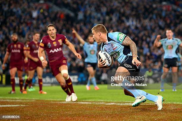 Trent Hodkinson of the Blues scores a try during game two of the State of Origin series between the New South Wales Blues and the Queensland Maroons...