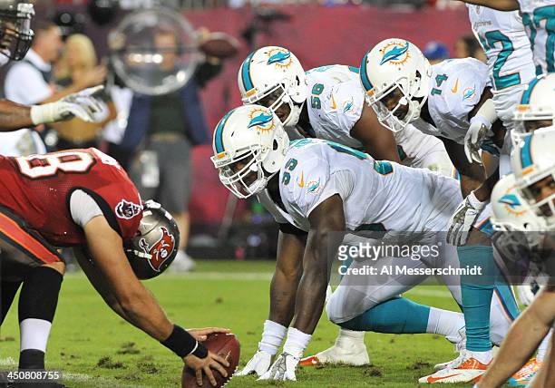 Defensive end Dion Jordan of the Miami Dolphins sets on defense against the Tampa Bay Buccaneers November 11, 2013 at Raymond James Stadium in Tampa,...