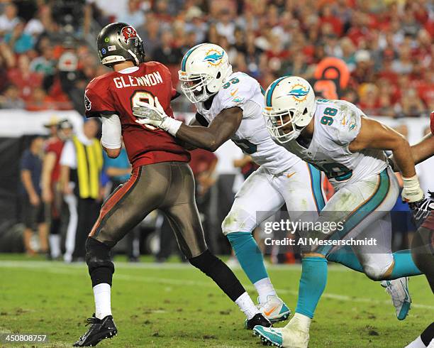 Defensive end Dion Jordan of the Miami Dolphins rushes quarterback Mike Glennon of the Tampa Bay Buccaneers November 11, 2013 at Raymond James...