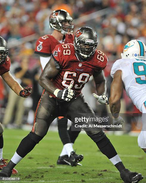Tackle Demar Dotson of the Tampa Bay Buccaneers blocks against the Miami Dolphins November 11, 2013 at Raymond James Stadium in Tampa, Florida. Tampa...