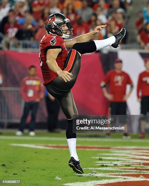 Punter Michael Koenen of the Tampa Bay Buccaneers kicks from the end zone against the Miami Dolphins November 11, 2013 at Raymond James Stadium in...