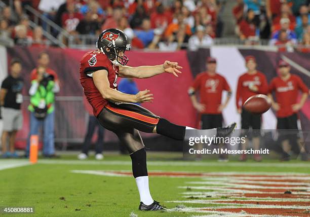 Punter Michael Koenen of the Tampa Bay Buccaneers kicks from the end zone against the Miami Dolphins November 11, 2013 at Raymond James Stadium in...