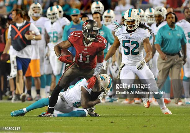 Wide receiver Tiquan Underwood of the Tampa Bay Buccaneers runs upfield with a pass against the Miami Dolphins November 11, 2013 at Raymond James...