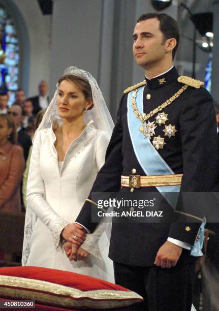 Spanish Crown Prince Felipe stands by his wife Princess of Asturias Letizia Ortiz at Madrid's Basilica of Atocha May 22, 2004. Spain's Crown Prince...