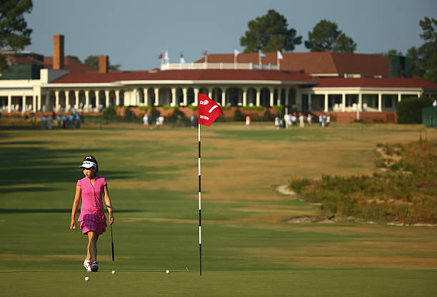 eleven year old amateur lucy li of the united states walks on the first green during a
