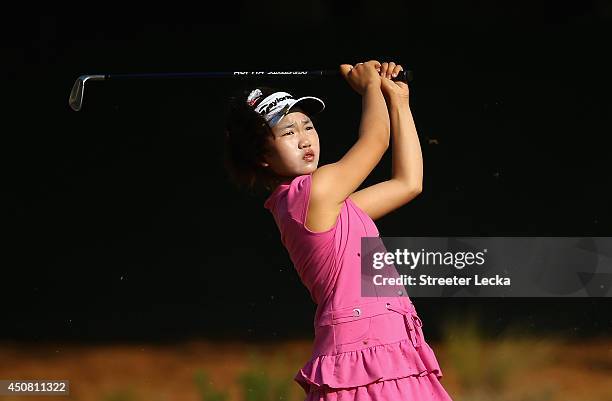 Eleven-year old Amateur Lucy Li of the United States watches a shot during a practice round prior to the start of the 69th U.S. Women's Open at...