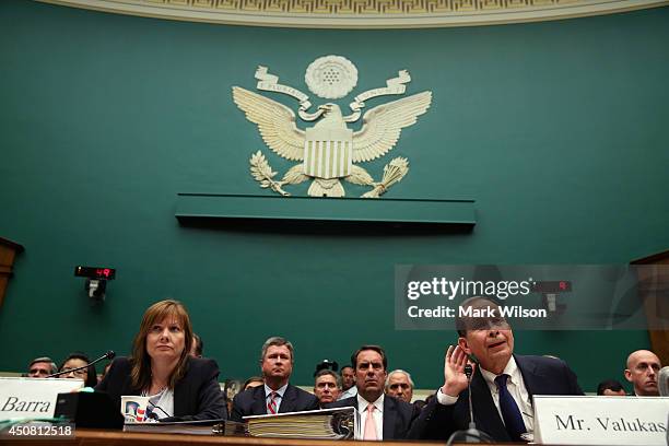 General Motors CEO Mary Barra , and Anton Valukas, head of GM's internal recall investigation, listen to questions while testifying during a House...