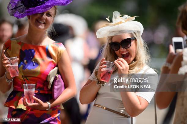Racegoers enjoy the sun on the second day of the Royal Ascot horse racing meet, in Berkshire, west of London, on June 18, 2014. Horse racing has been...