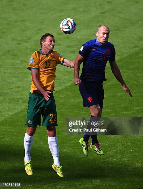 Mitchell Langerak of Australia and Arjen Robben of the Netherlands go up for a header during the 2014 FIFA World Cup Brazil Group B match between...